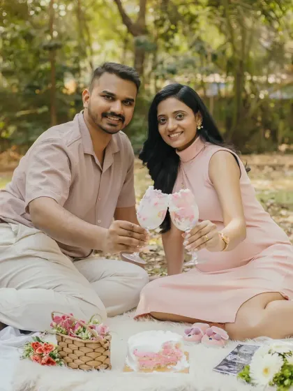 Cheers to the parents-to-be. This fun and celebratory shot at your outdoor picnic is a wonderful way to capture your excitement.