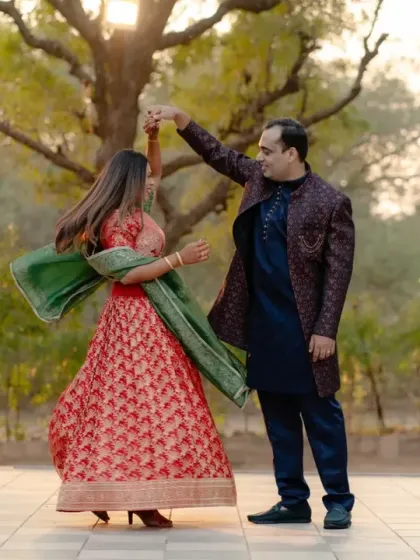 A playful twirl in the garden. This photo captures a lighthearted, in-between moment that feels more authentic than any stiff pose. The movement in her lehenga adds a beautiful, dynamic element.