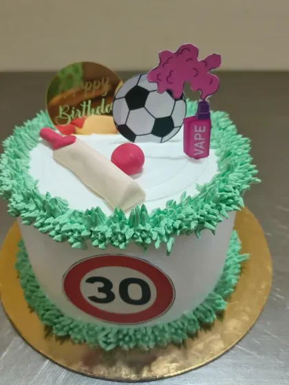 A 30th birthday cake that combines a few of the birthday person's favorite things: cricket, football, and vaping.