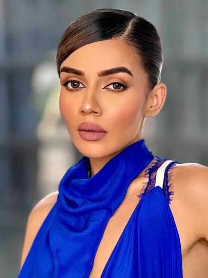 Fire. Komal Pandey in a stunning blue dress with a clean, sharp makeup look that is both modern and powerful.