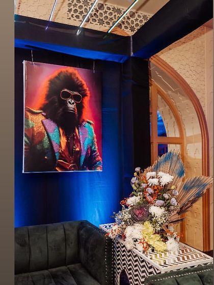 Quirky and cool decor, like this portrait of a gorilla in a suit, adds personality and a talking point for guests.