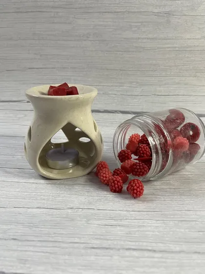 A ceramic diffuser with a jar of our handmade soy wax melts. This is a great flameless fragrance option and a beautiful gift.