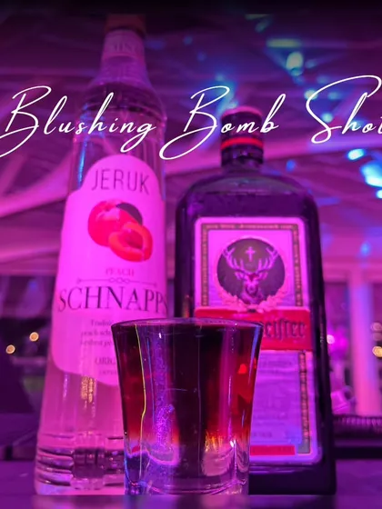 The 'Blushing Bomb' shot, a potent and delicious mix of Jägermeister and peach schnapps, is always a party starter.