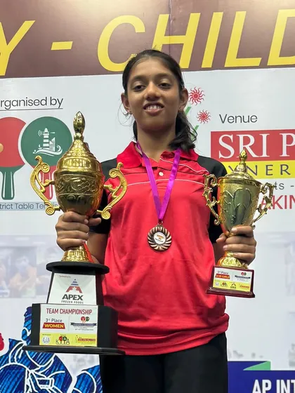 Celebrating a fantastic double win for our paddler Eshaa at the Andhra Pradesh State Ranking Tournament. She proudly displays her trophies for winning Gold in the Under 17 Girls Singles and Bronze in the Under 19 category.
