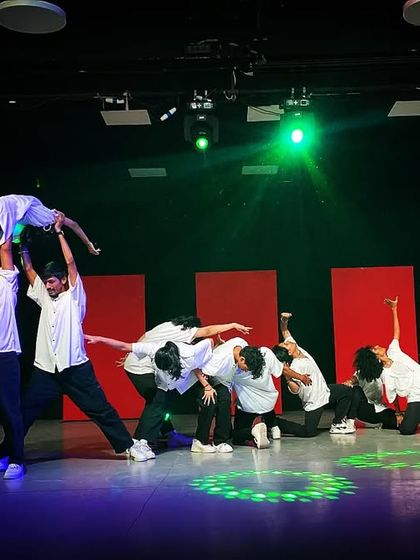 A powerful lift and group formation from the Allstars Night showcase. This highlights the trust and teamwork developed within the student batches during our training process.