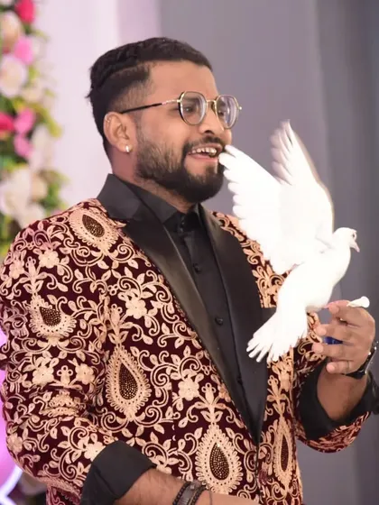 A dove perches on my hand after a magical appearance. These are the moments of quiet wonder that balance the high-energy comedy in my show.