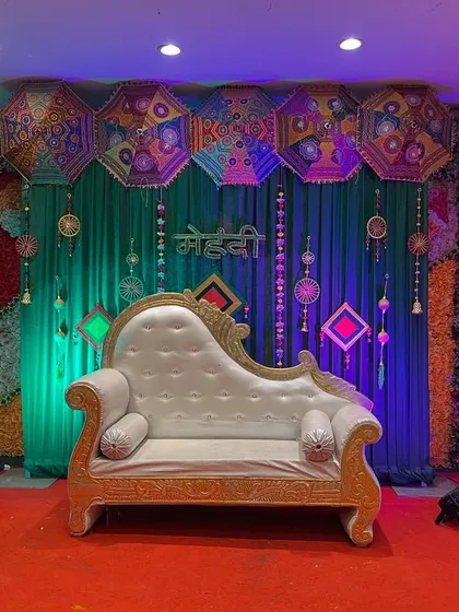 The same Mehendi stage with a classic white and gold diwan, showing how we can customize the seating to your preference.