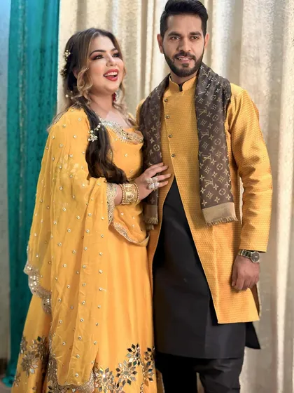 The happy couple, ready to party. Her makeup is designed to look amazing in photos and last all night.