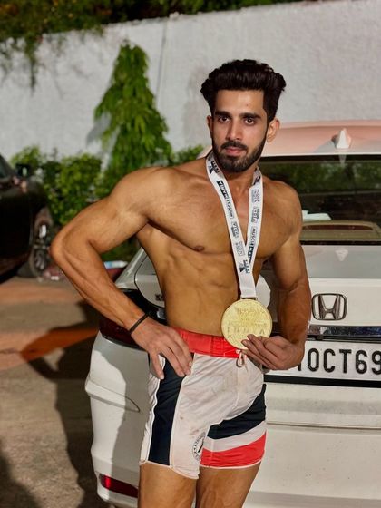 Posing with the medal after the show.