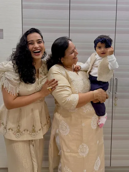 "My Magical World in a frame." A candid, joyful photo of me, my mom, and Gauri. This image is pure happiness and celebrates the three generations of women in my family.