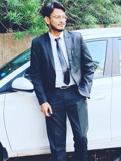 A photo taken near the Bar Council of Delhi, dressed in a suit and tie for a formal occasion.