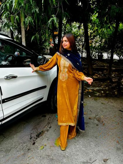 A full view of the mustard velvet suit. The straight-cut pants and embroidered kurta create a sophisticated and elegant ethnic look.