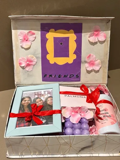 For the bride who loves F.R.I.E.N.D.S! This themed hamper features the iconic purple door frame, a photo of her friends, and pampering gifts, all delivered to Kashmir.