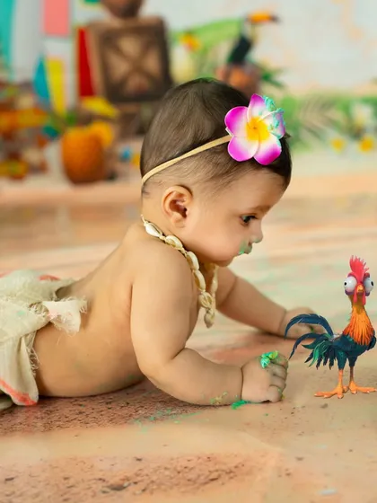 Making friends with Hei Hei the rooster. I love incorporating playful props that children can interact with during their themed photoshoots.