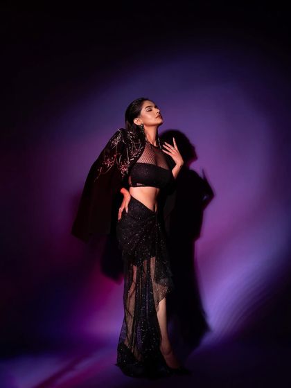 A dramatic, full-length portrait of Anushka Sen for a GQ 'Men of the Year' feature. I used colored gels and hard shadows to create a moody, high-fashion vibe.