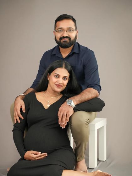 A gorgeous and classic pose for a maternity portrait. The way she rests her head on his shoulder shows their comfort and connection as they wait for their baby.