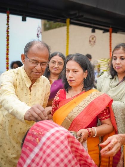 Family members participating in the Haldi ceremony, blessing the bride. I focus on capturing the involvement of loved ones in these important traditions.