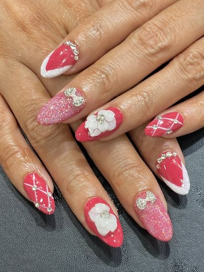 A festive pink and white set with glitter, 3D bows, 3D flowers, and a quilted pattern.
