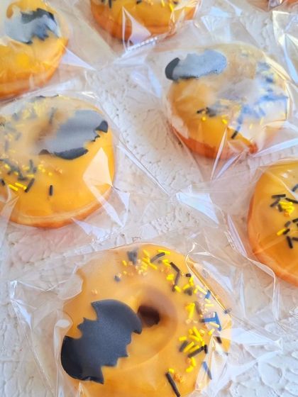 Batman-themed donuts, also individually wrapped for a party.