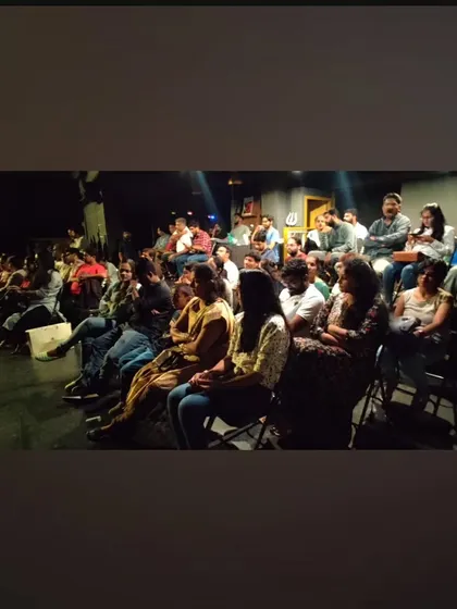A wide shot of our audience during a student showcase, highlighting the supportive community that comes to cheer on new talent.