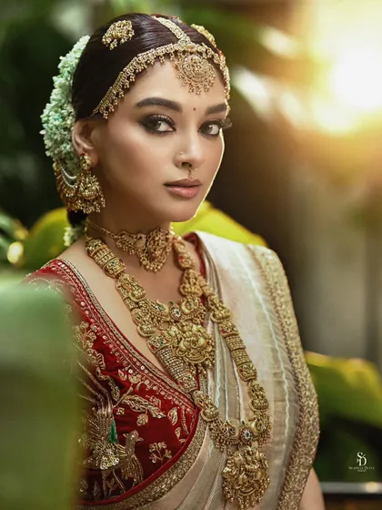 This portrait showcases a blend of cultural styles, with elaborate temple jewellery and a modern sensibility. It demonstrates my versatility in creating stunning bridal looks that honor heritage while feeling fresh and contemporary.