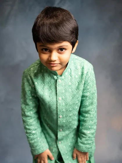 Another look at our mint green Patiala set, showcasing its subtle texture and classic design. It's a fresh and charming choice for any festive event.