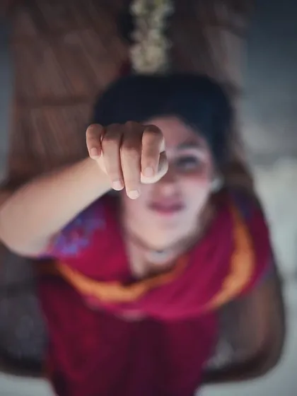 A close-up of the 'mukula' hasta, another hand gesture from the rich vocabulary of Bharatanatyam. This photo contemplates the dancer's identity and whether it is the costume that creates the character or if the dance is already an intrinsic part of who we are.