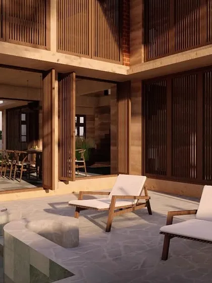 The poolside patio of the Morjim villa, with large foldable doors that allow the living space to merge completely with the outdoors.