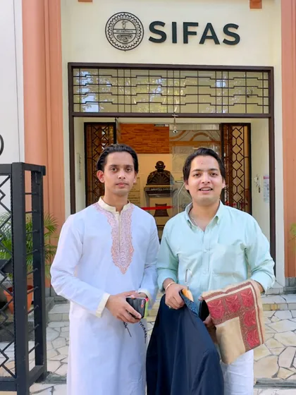 Posing with my brother outside SIFAS, where our father taught sitar in 1996. It was a nostalgic and meaningful visit for both of us.