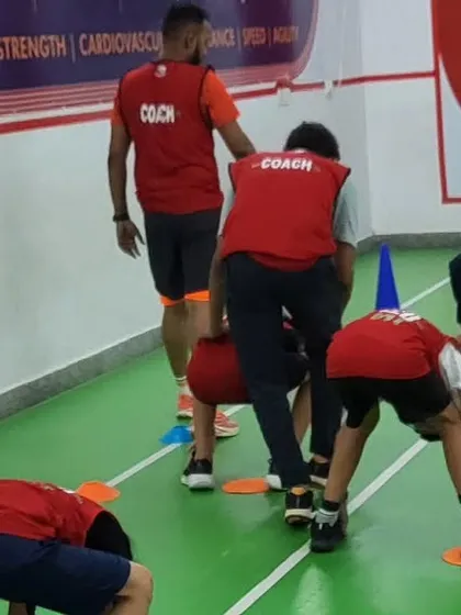 Bending and touching the markers is a great drill for flexibility and body control. We make sure every child gets the technique right.