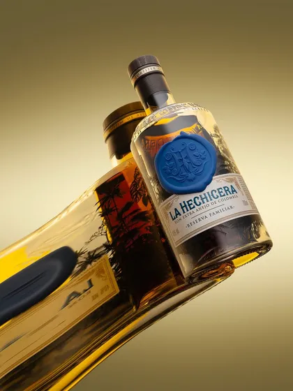 Another experiment with the "flowing" bottle concept, this time with La Hechicera rum. The distorted reflection and the way the blue wax seal pops against the golden liquid creates a surreal and eye-catching image.