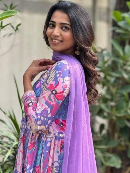 A vibrant and playful multicolor kurta pant set. The floral and abstract print in shades of purple and blue makes it a unique piece for your wardrobe.