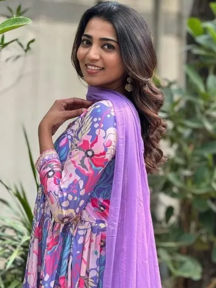 A vibrant and playful multicolor kurta pant set. The floral and abstract print in shades of purple and blue makes it a unique piece for your wardrobe.