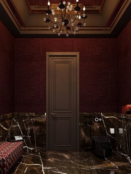 A different perspective of the dramatic red and black powder room, showing the custom black toilet and the patterned bench, which adds another layer of texture and color.