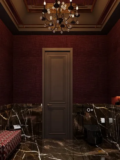 A different perspective of the dramatic red and black powder room, showing the custom black toilet and the patterned bench, which adds another layer of texture and color.