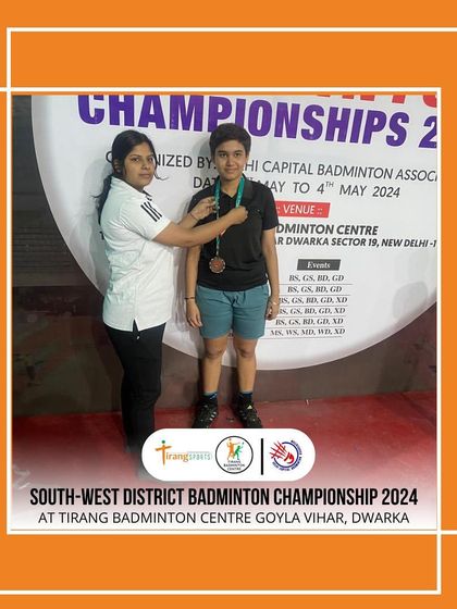 A participant receiving her medal at the South-West District Badminton Championship hosted at my Goyla Vihar center.