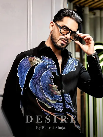 A direct, engaging portrait in the abstract wave shirt. This is for the man who appreciates art and is not afraid to wear it.