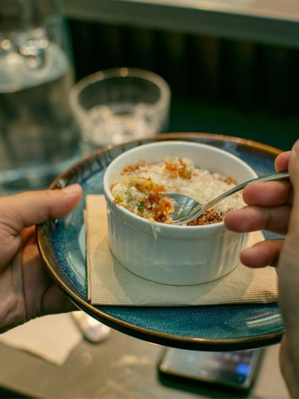 A guest enjoying a dish from The Second House, Goa. The experience is about savoring every bite and the stories behind it.