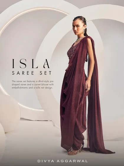 The full silhouette of the Isla Saree Set, a stunning ode to craftsmanship with its dhoti-style pre-draped saree and embellished corset blouse.