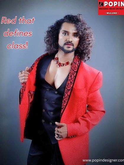 For those who want to make a bold entrance, I offer this striking red blazer. It features detailed embroidery on the lapels and is paired with a black waistcoat for a dramatic look.