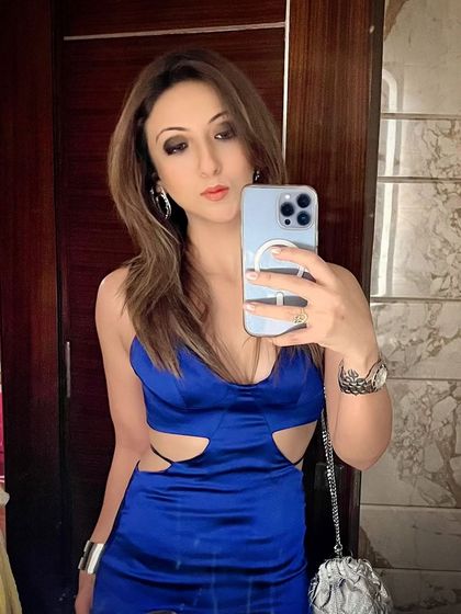 A mirror selfie in a vibrant blue cutout dress. It's not my usual Tuesday attire, but sometimes it's fun to dress up.