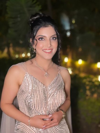 A candid moment of happiness. We love capturing these shots where the bride's joy is the most beautiful part of the look.