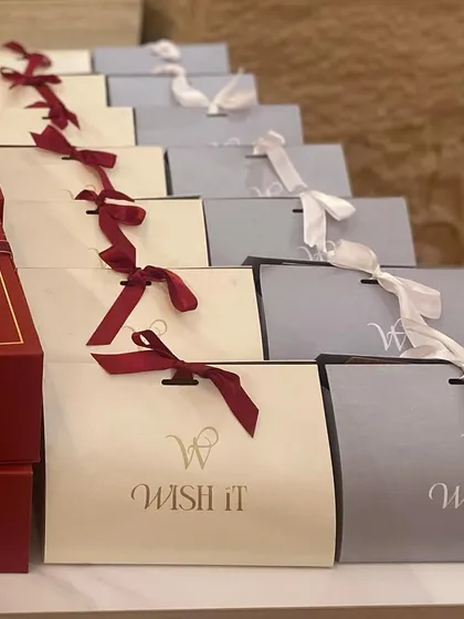 A mix of our premium boxes and custom gift bags, ready for guests. This shows the flexibility in our packaging solutions for any event.
