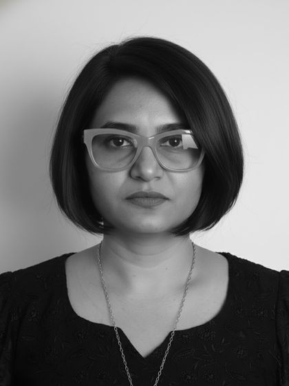 A direct, powerful portrait in black and white, where the sharp lines of the bob haircut take center stage.