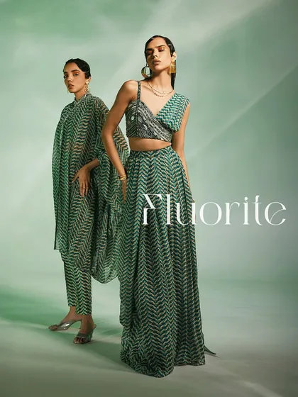 This is the Fluorite collection, designed for the modern woman with tradition in her heart. I paired a printed, hand-embroidered asymmetrical blouse with a flowing drape-style skirt to create a look that is both fresh and timeless.