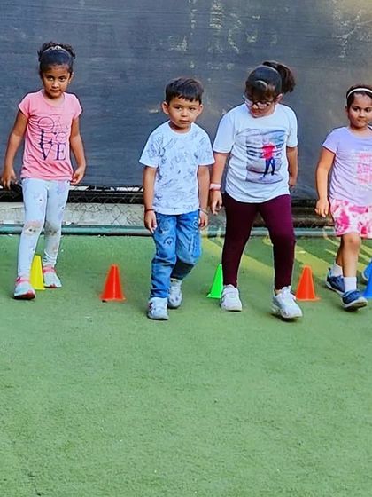 Follow the leader! Simple drills like walking or running through cones help improve a child's spatial awareness and ability to follow directions. It's a foundational skill for learning more complex sports later on.