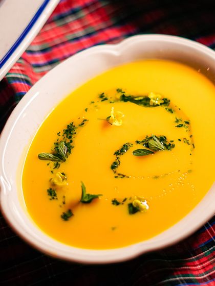A cozy bowl of our butternut squash soup, a warming starter from our Christmas menu. It's the perfect way to begin a festive meal.