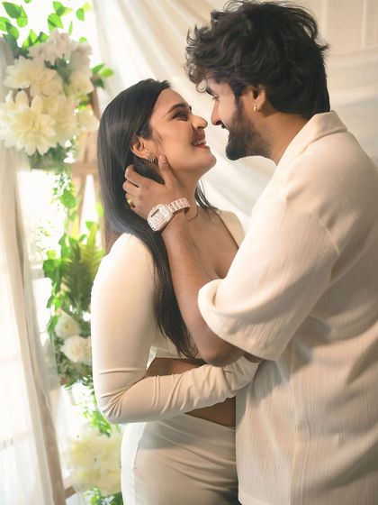 A look of pure love and adoration. This close-up captures the couple's faces as they gaze at each other, their happiness and excitement shining through.