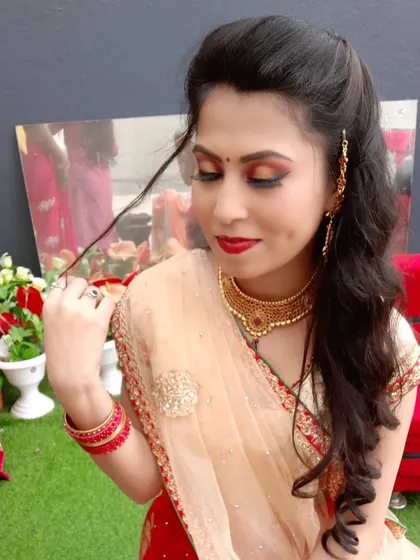 A close-up on the eye makeup for this reception look. I used a blend of gold and brown shadows to create a warm, sultry smokey eye that complements her skin tone and outfit.