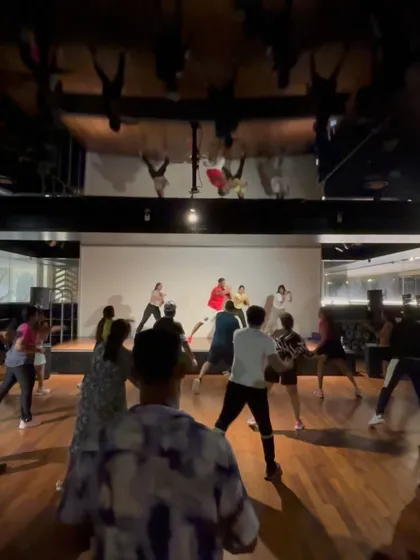 A wide shot of the dance floor during a community event. I love creating spaces where people can come together to move and have a great time.